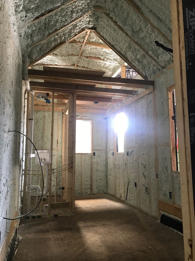 Spray foam insulation inside a 20-ft tiny house